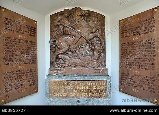 Relief of St. George slaying the Dragon, memorial plaques of the fallen in the First World War, 1914-1918, at the parish church of St. Sebastian, Ramsau bei Berchtesgaden, Berchtesgadener Land District, Upper Bavaria, Bavaria, Germany, Europe.