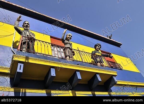 V.l. Carlos Gardel, Evita Peron, Diego Maradona, cardboard cut-outs on a balcony in the dock area La Boca, Buenos Aires, Argentina, South America.