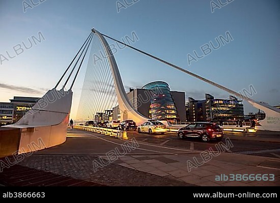 Cars on Samuel Beckett Bridge, cable-stayed bridge and swing bridge over the river Liffey, blue hour architect Santiago Calatrava, Dublin, Republic of Ireland.