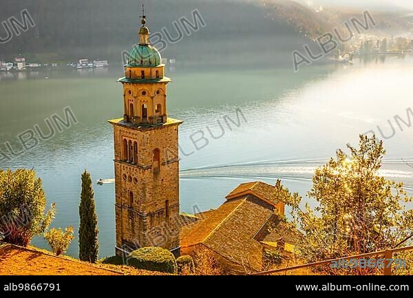 Church Tower Santa Maria del Sasso with Sunlight and Mountain on Lake Lugano in Morcote, Ticino in Switzerland.