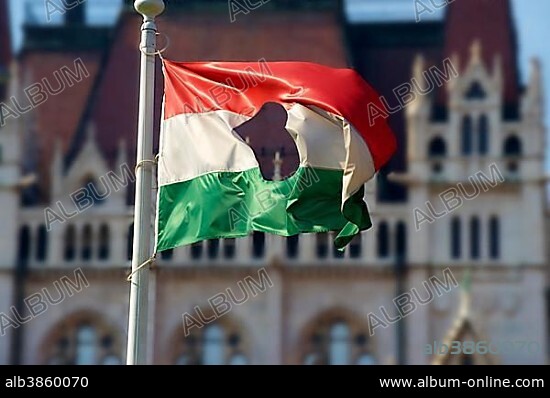 Flag with a hole, commemorating the 1956 uprising outside Parliament, Budapest, Hungary, Europe.