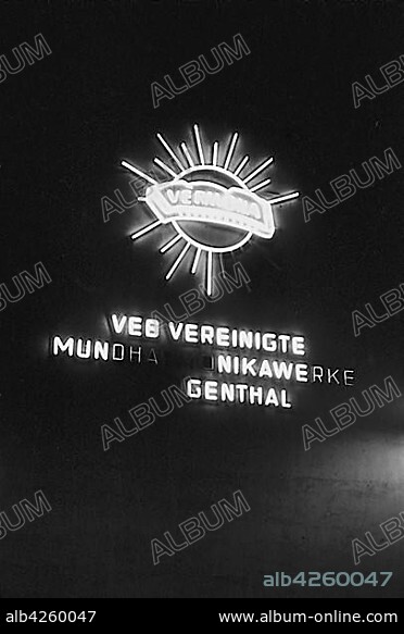 Illuminated advertising for the VEB Vereinigte Mundharmonika Werke, 1953, Leipzig, Saxony, GDR, Germany, Europe.