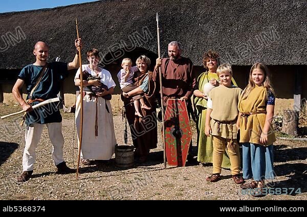Family, outdoor museum "Hjemsted Oldtidspark", a village of the Iron Age, Skaerbaek, Danmark.