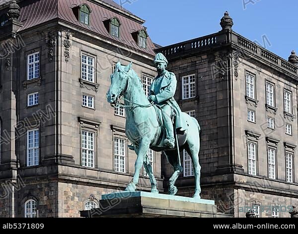 Christiansborg Castle with equestrian statue of King Frederik VII, seat of the Danish Parliament, Copenhagen, Denmark, Scandinavia, Northern Europe, Europe.