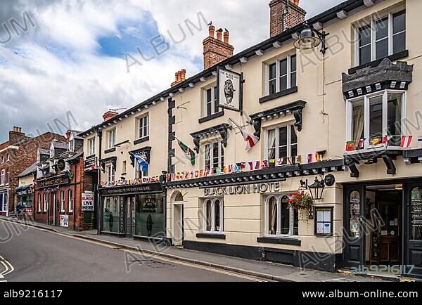 ELLESMERE, SHROPSHIRE, UK - JULY 12 : View of the Black Lion Hotel in Ellesmere, Shropshire on July 12, 2021. One unidentified man.