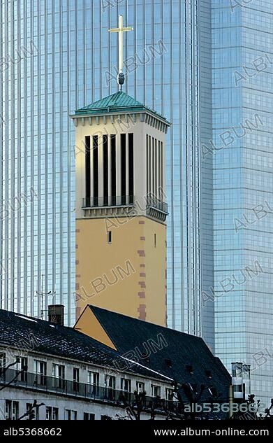 The tower of the Matthaeuskirche infront of the Pollux tower, Frankfurt, Hesse, Germany.