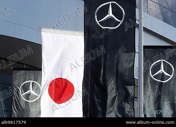 Mercedes-Benz Museum; Stuttgart; architecture Ben van Berkel; UNStudio. In front of it flags of Mercedes and the flag of Japan; automotive industry; Stuttgart; Baden-Württemberg; Germany; Europe.