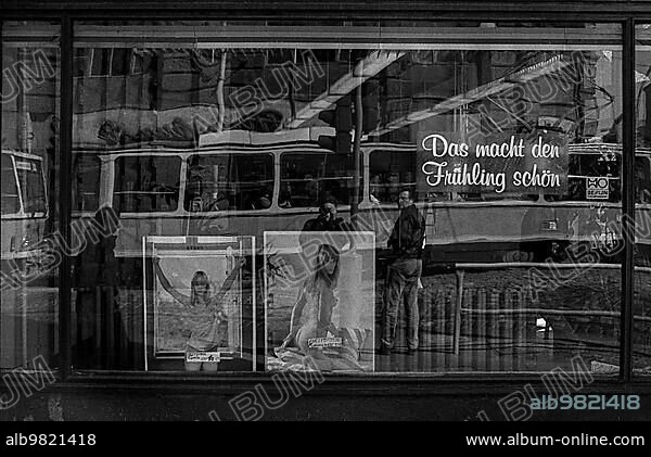 GDR; Berlin; 05.04.1990; magazines (or photos) with naked woman in a shop window; spring ???.