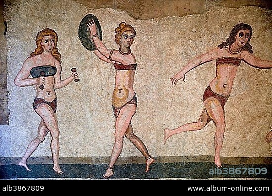 Floor mosaic of three women in bikini during sports, Bikini Girls' Hall, Villa Romana del Casale, 4th century AD Roman villa, Piazza Armerina, Enna Province, Sicily, Italy, Europe.