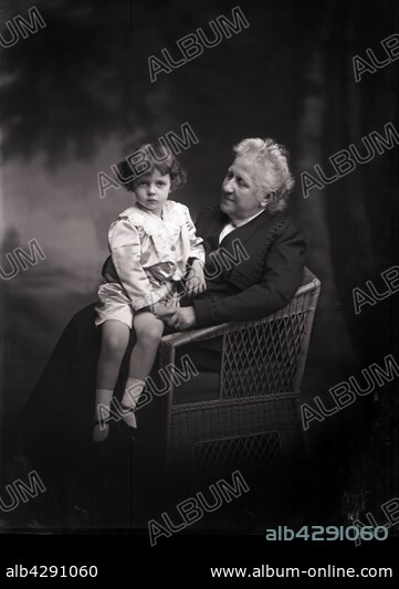 Isabel, Princess Imperial of Brazil (1846-1921), countess of Eu by her marriage in 1864 with Gaston of Orleans (1842-1922), count of Eu.. The child on her knees is possibly the duke of Nemours ( Louis of Orleans).. c.1910. Boissonnas and Taponier Photo. Photo12.com - Coll. Taponier.