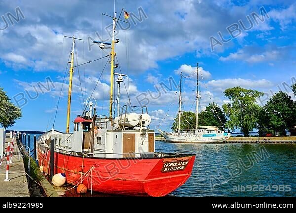 The cutter Nordland III, a former war fishing cutter that was demilitarised after World War II, at its mooring in the city harbour of Greifswald Wieck, Hanseatic City of Greifswald, Mecklenburg-Western Pomerania, Germany, Europe.