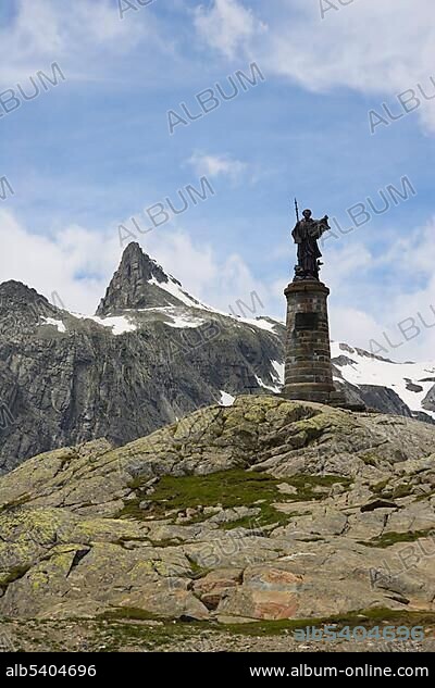 Statue of Saint Bernard, Grand Saint-Bernard, Great St Bernard Pass, Col du Grand-Saint-Bernard, Colle del Gran San Bernardo, Pennine, Valais Alps, Italy, Europe.