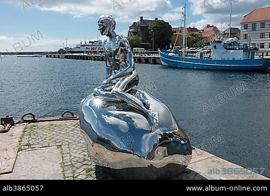 Sculpture of little merman Han, by artists Elmgreen and Dragset, at Cultural Harbour Kronborg in Elsinore, Denmark, Europe.