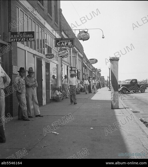 DOROTHEA LANGE. Main street during 1936 drought, Sallisaw, Sequoyah