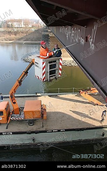 Office of Municipal Sanitation and Renovation cleanse Graffiti from a bridge in Koblenz with an elevating platform truck, Koblenz, Rhineland-Palatinate, germany.