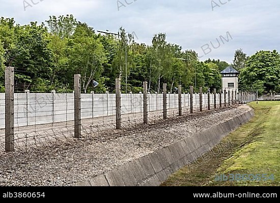 Barbed wire fence, moat and watchtower, Dachau Concentration Camp, Dachau, Bavaria, Germany, Europe.