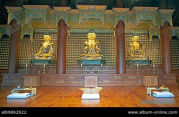 Golden Buddha statues in the temple, May 18th Memorial Park, Gwangju, Jeollanam-do Province, South Korea, Asia.