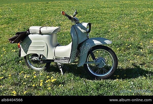 DDR Moped Schwalbe in a meadow, Germany, Europe.