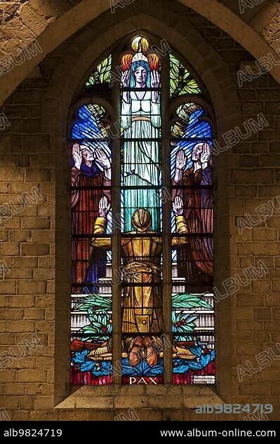 Stained-glass window in Necropolis with graves of Belgian World War One soldiers buried in the church of Grimde near Tienen; Tirlemont; Belgium; Europe.