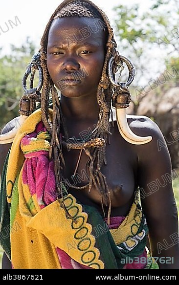Woman with headdress, portrait, tribe of the Mursi, Southern Nations Nationalities and Peoples' Region, Ethiopia, Africa.
