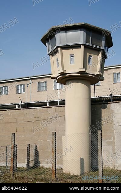Observation tower and prison wall with barbed wire, Berlin-Hohenschoenhausen memorial, former prison of the German Democratic Republic's secret service, Berlin, Germany, Europe.