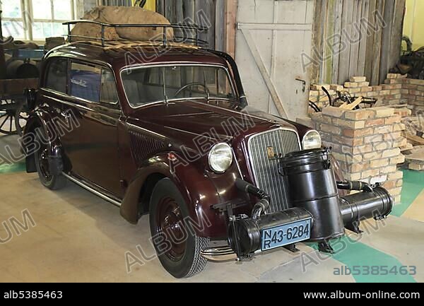 Opel Olympia with a wood gas generator, built in 1936, due to gasoline shortages after the war it was converted in 1946 to be powered by the gas from sulphurated wood, ErfinderZeiten: Auto- und Uhrenmuseum, Time of Innovators: Museum of Cars and Clocks, Schramberg, Black Forest, Baden Wuerttemberg, Germany, Europe.
