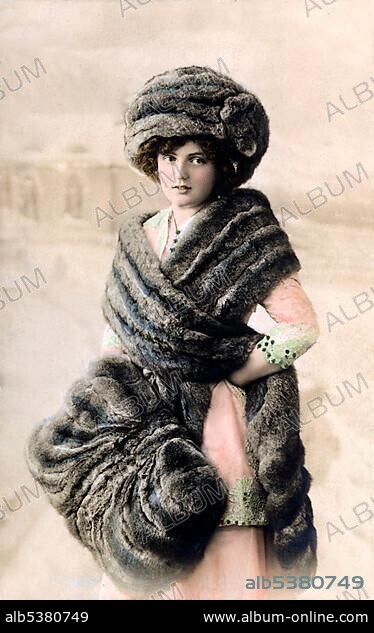 Woman wrapped in fur, historical photo, circa 1910.