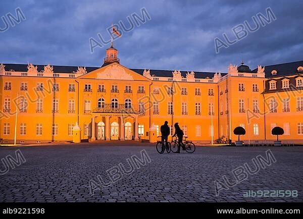 Illuminated castle in Karlsruhe, Germany at blue hour.