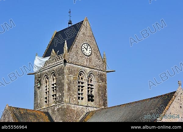 Parachute memorial in honour of paratrooper John Steele, who was trapped on the church tower during D-Day, Sainte Mere Église, Normandy, France, Europe.