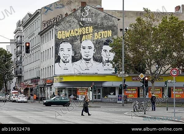 A picture of the brothers Jérôme Boateng, George Boateng and Kevin-Prince Boateng can be seen on a wall in the Wedding district of Berlin. The mural Grown on concrete is located in the Wedding district and is intended to symbolise the career of the three Boateng brothers and the history of their football pitch in Wedding. the graffiti with the inscription was applied by Nike, 29.09.2019.