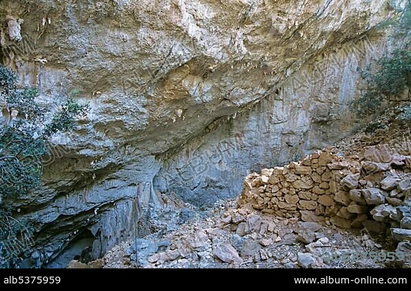 Remains of a Nuraghic village in the sinkhole of Tiscali Sardegna Italy.