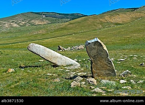 Stone steles decorated with animal engravings and patterns, called stalagmite, ancient Bronze Age tomb, Khangai Nuruu National Park, Oevoerkhangai Aimag, Mongolia.
