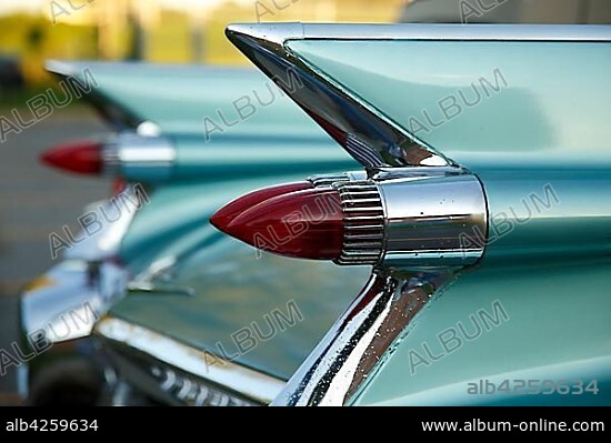 Tail fins with red tail lights of an american vintage car, Cadillac de Ville 1959, Canada, North America.