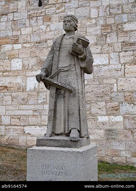 Monument to the theologian and reformist Thomas Müntzer (ca. 1489-1525), created in 1957 by W. Lammert, at the woman's gate of the town wall of Mühlhausen, Thuringia, Germany, Europe.