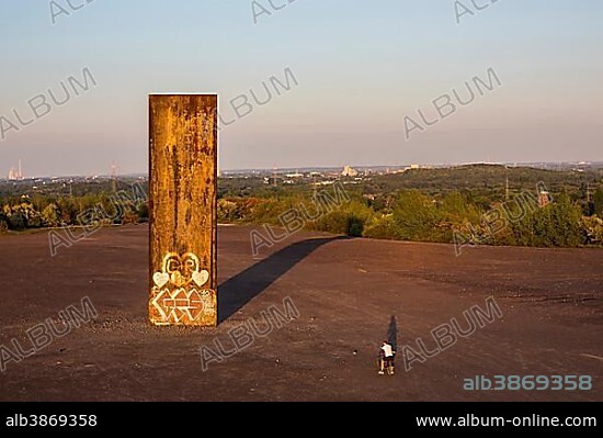 "Bramme fuer das Ruhrgebiet" or "Slab for the Ruhr area", piece of art by Richard Serra on the Schurenbachhalde heap, Essen, North Rhine-Westphalia, Germany, Europe.