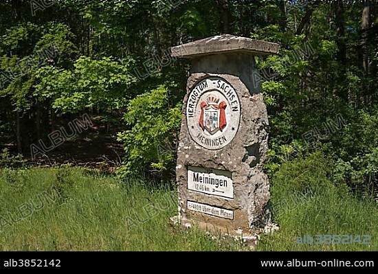 Historic boundary stone with crest of the Duchy of Saxe-Meiningen, now border of Thuringia and Bavaria, Henneberg, Thuringia, Germany, Europe.