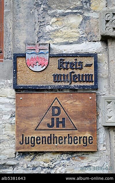 Coat of arms, Sign with German inscription Kreismuseum, County Museum, Jugendherberge, Youth Hostel, Wewelsburg, triangular castle, former Nazi cult and terror center of the SS, today historical museum, hostel, Bueren, Paderborn, North Rhine-Westphalia, Germany, Europe.