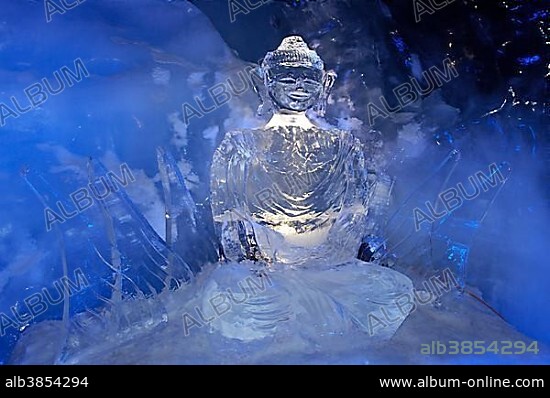 Ice Buddha statue in an ice cave in the Gletscherpalast or Glacier Palace, Klein Matterhorn Mountain, Zermatt, Valais or Wallis, Switzerland, Europe.