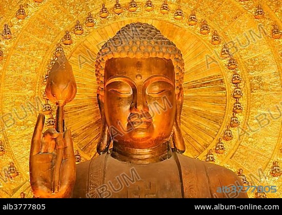 Golden Buddha statue at the construction site of the Chua Bai Dinh pagoda, one of the largest pagodas in Southeast Asia, near Ninh Binh, Vietnam, Southeast Asia, Asia.
