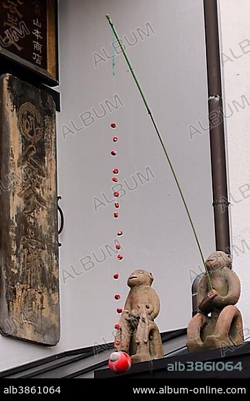 Talisman, Migawari-zaru, monkey symbol specifies the number of occupants and dispels disaster, Buddhist, Shinto, Taoist, Nara, Nara-machi, Japan, Asia.