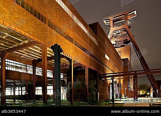 Zeche Zollverein Coal Mine Shaft XII with headframe, illuminated at night, Essen, Ruhr area, North Rhine-Westphalia, Germany, Europe.