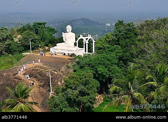 Buddha statue in the lotus position in the Buddhist monastery of Mihintale, Anuradhapura, North Central Province, Sri Lanka, Asia.