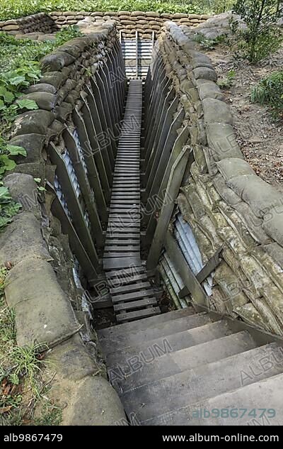 Reconstruction of British First World War One trench showing wooden duckboards on A frames, sandbags and sheets of corrugated iron at Zonnebeke, Belgium, Europe.