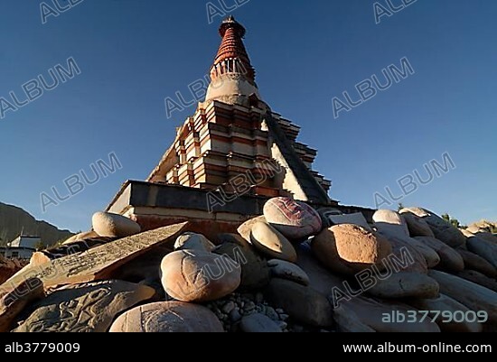Tibetan stupa, chorten, with mani stones, Red Stupa of Toling, near the temple of Toling in the ancient Kingdom of Guge Sutlej Canyon, Ngari Province, Western Tibet, Tibet, China, Asia.