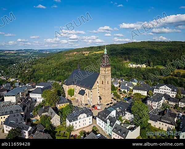 Schneeberg is a town in the Erzgebirge district of Saxony. High above the town, the town church of St Wolfgang, Schneeberg, Schneeberg, Saxony, Germany, Europe.