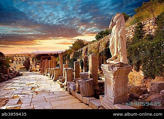 Statue on Curetes Street looking towards the Library of Celsus, Ephesus Archaeological Site, Anatolia, Turkey, Asia.