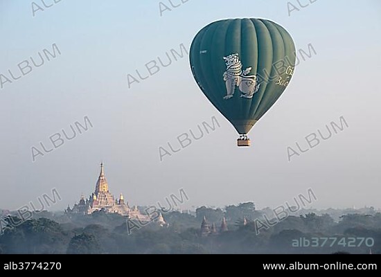 Hot air balloon over the landscape, Ananda Temple, temple complex with a gold-plated tower structure or Shikhara, stupas, pagodas, Plateau of Bagan, Mandalay Division, Burma or Myanmar.