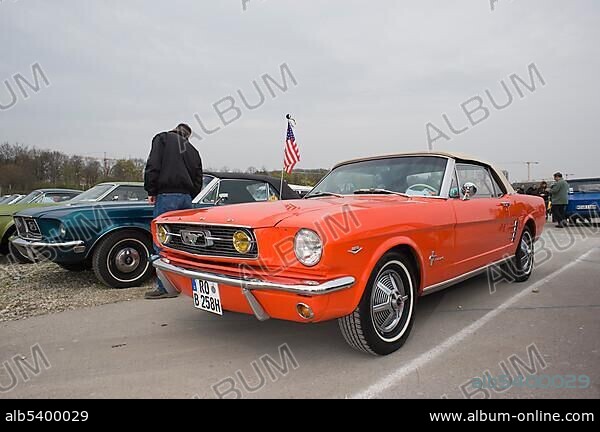 Ford Mustang with an American flag, classic car convention, Theresienwiese area, Munich, Bavaria, Germany, Europe.