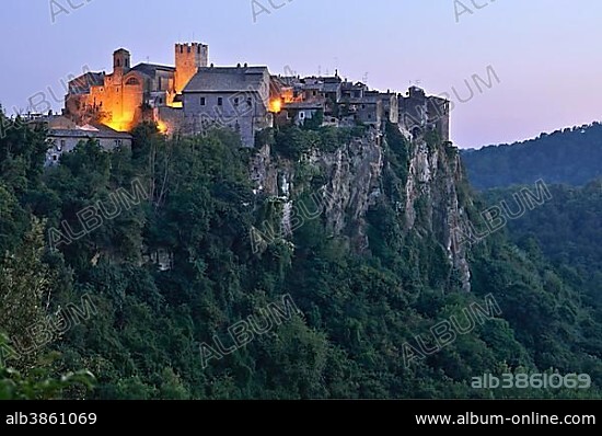 Medieval town of Vecchia Calcata on a plateau of tufa rock at sunset, valley of the Treia River, Parco Naturale del Valle Treia, Treia Valley Natural Park, Lazio, Italy, Europe.