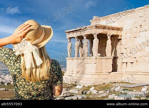 Woman gazes at the erechtheion or temple of athena polias